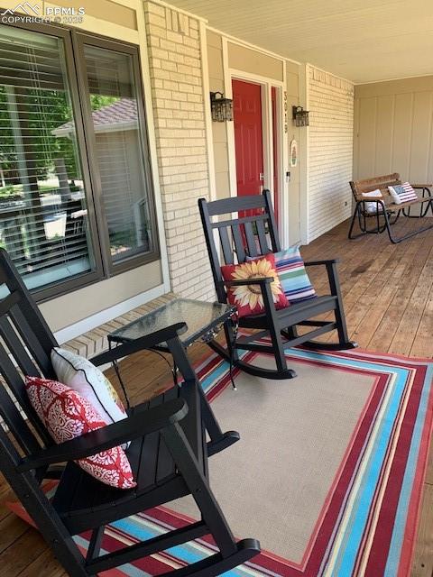 Image 4 of 48: Covered Front Porch with Redwood Decking