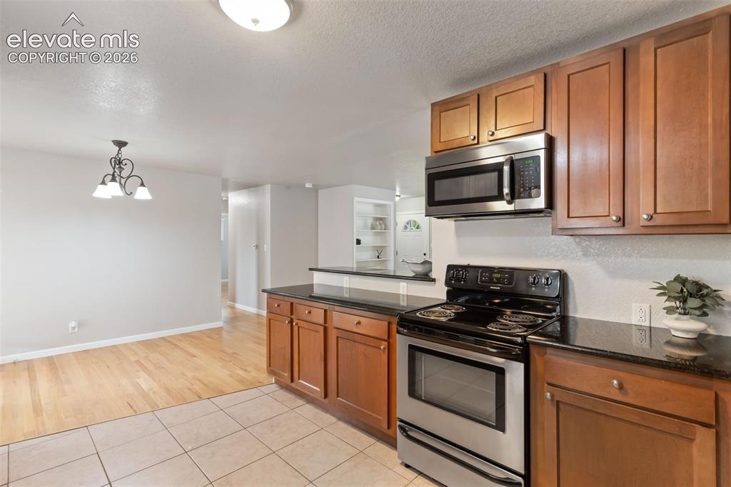 Image 21 of 21: Kitchen area conveniently flows into the dining room 