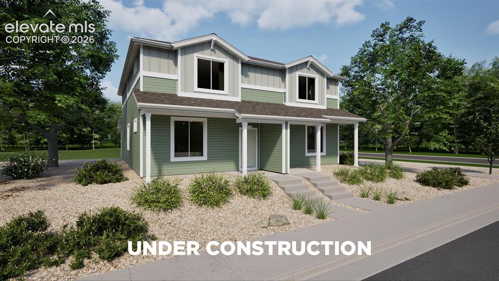 Image 1 of 26: Two-story residence featuring a covered front porch with white columns, two