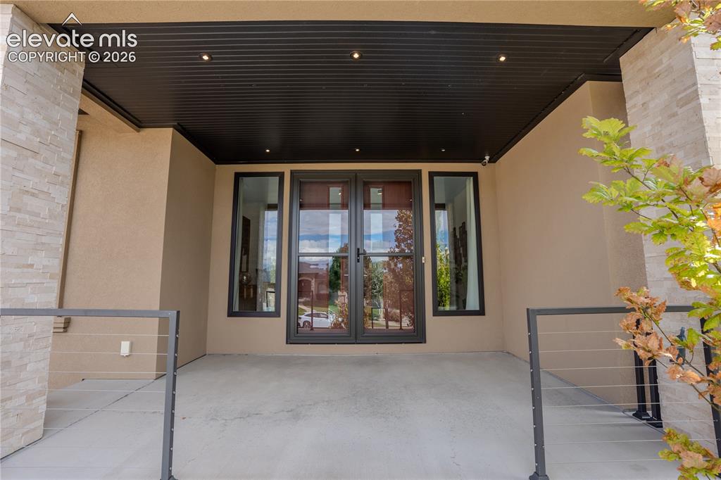 Image 4 of 50: 8ft Doors elevate this entrance