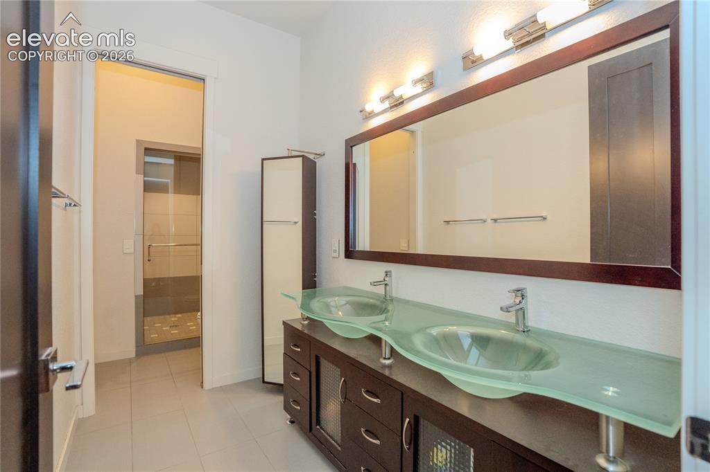 Image 41 of 50: Double vanity and walk in shower in the bath downstairs