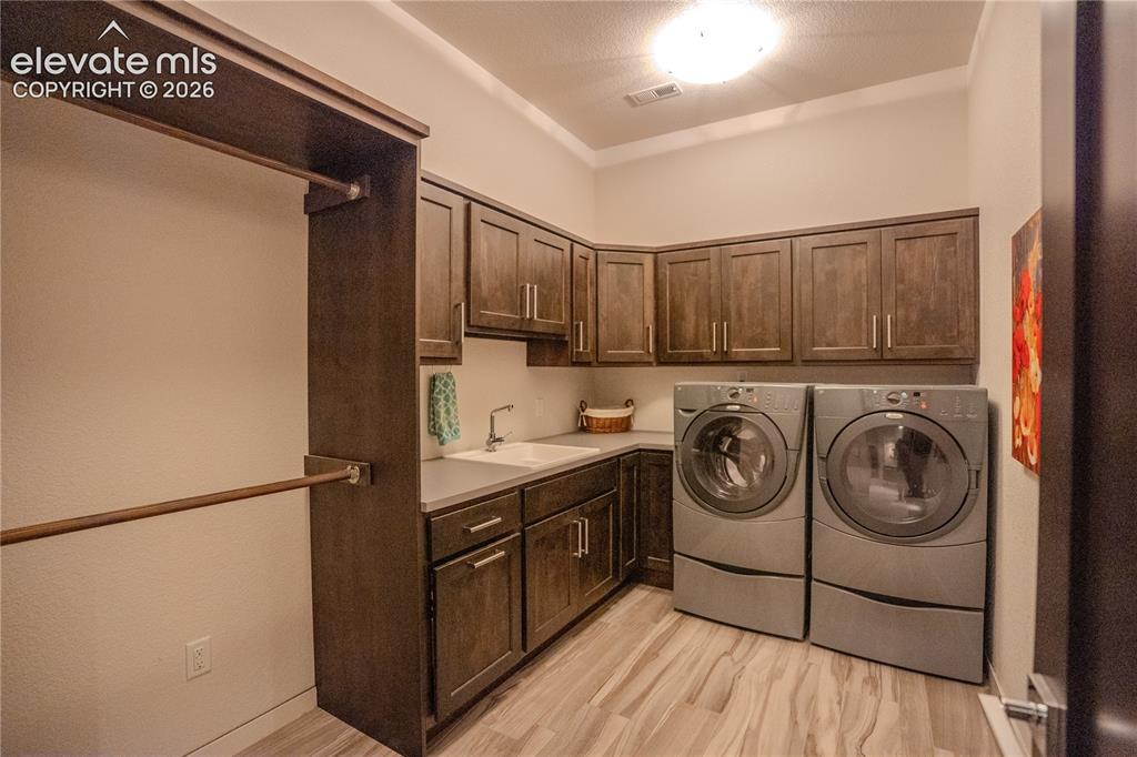 Image 44 of 50: Full size laundry in the basement