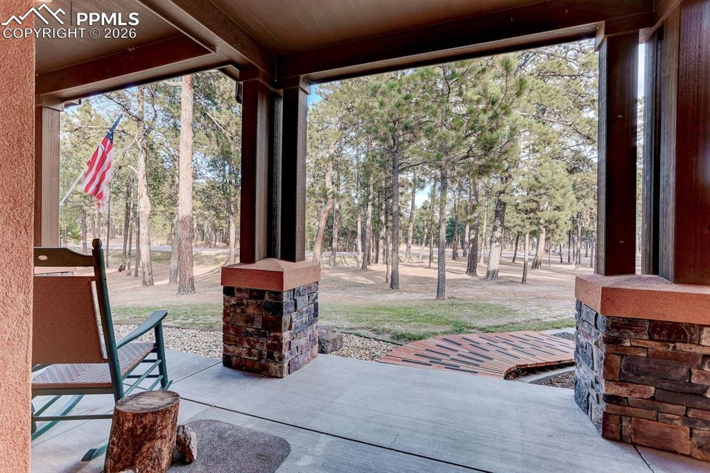 Image 3 of 45: View of front covered porch  featuring view of  front yard
