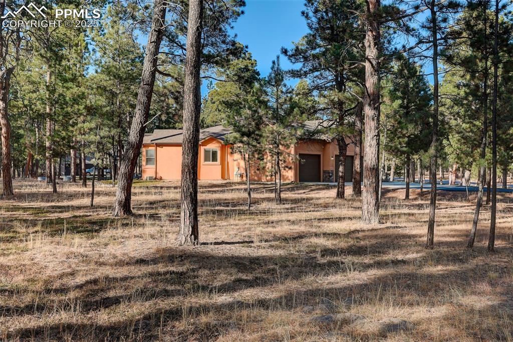 Image 44 of 45: Corner lot featuring side yard/ rear yard view