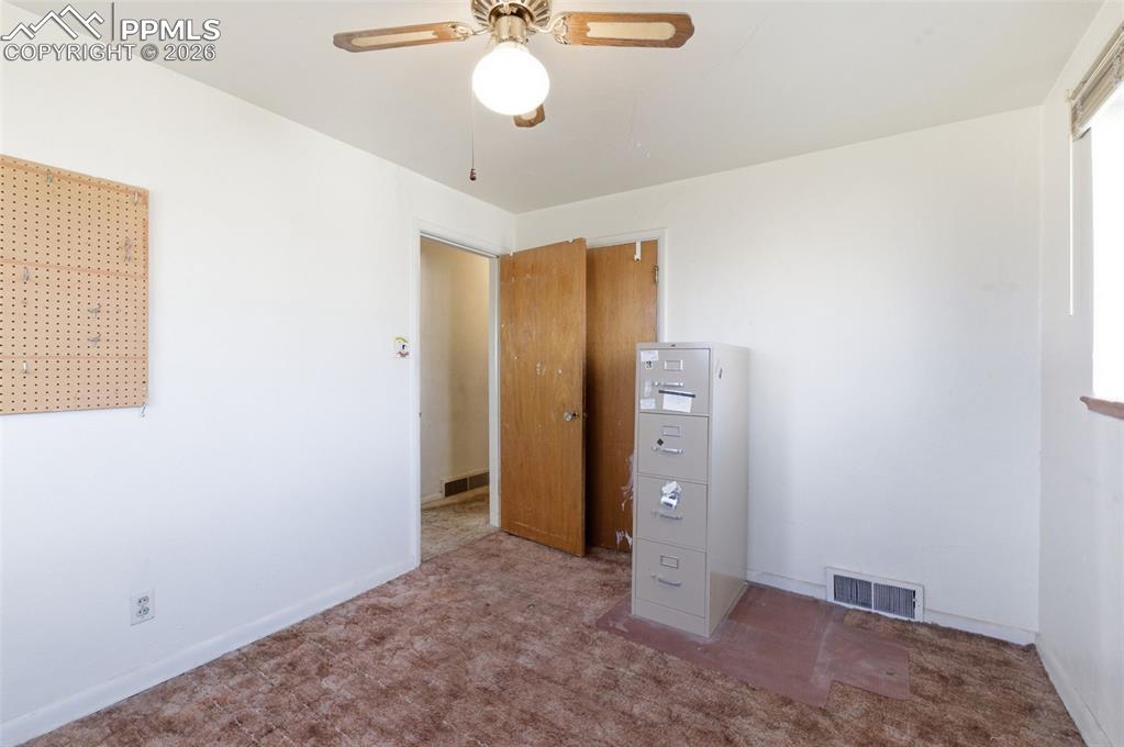 Image 17 of 35: Unfurnished bedroom with carpet floors and ceiling fan