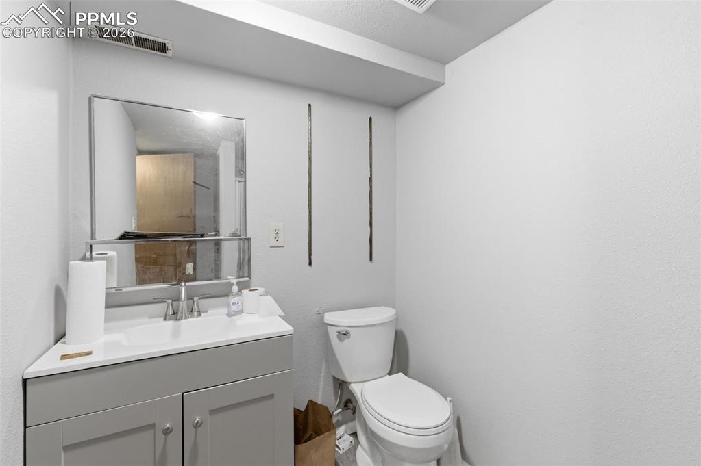 Image 29 of 35: Bathroom featuring vanity and toilet