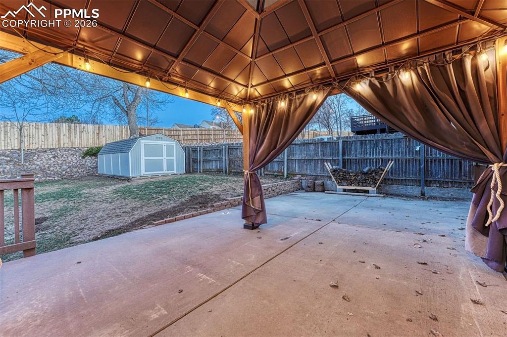 Image 13 of 49: 12x12 pergola is ready for day and night entertaining