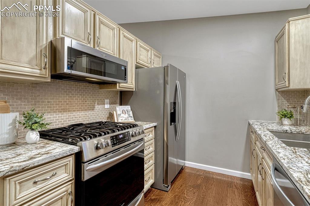 Image 3 of 49: Custom cabinets and newer appliances