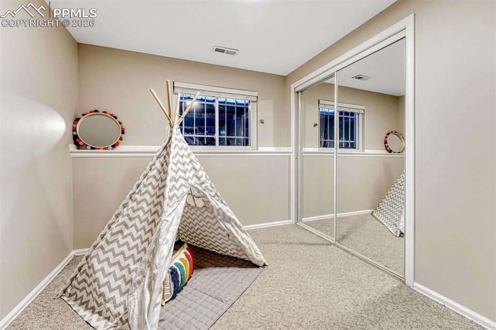 Image 34 of 49: Basement bedroom