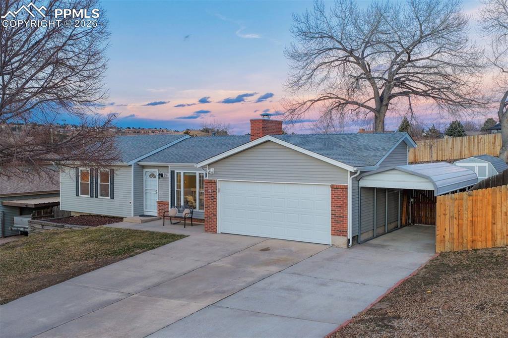 Image 41 of 49: Notice 2 car garage with 3 car carport
