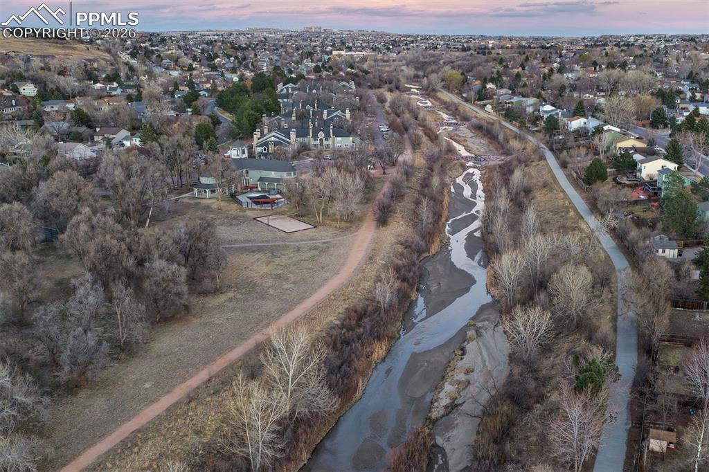 Image 44 of 49: Cottonwood Creek with paved and gravel trails