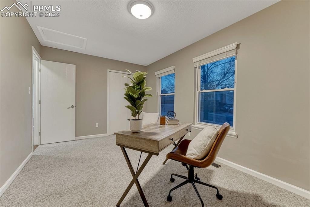 Image 7 of 49: Large main level bedroom 2 has mountain views