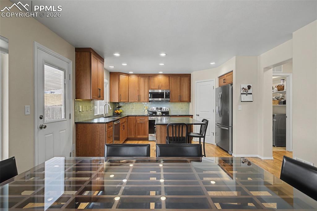 Image 11 of 50: Custom remodeled kitchen featuring a corner pantry and large island!