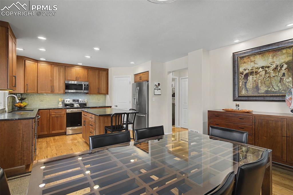 Image 12 of 50: Custom remodeled kitchen featuring a corner pantry and large island!