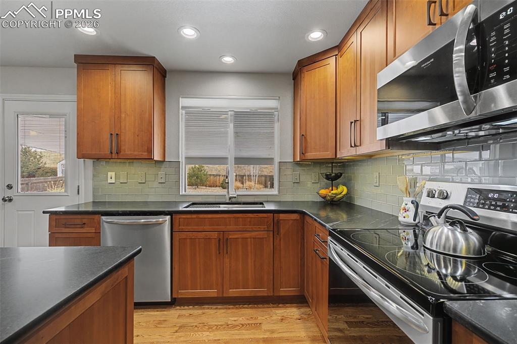 Image 17 of 50: Custom remodeled kitchen featuring a corner pantry and large island!