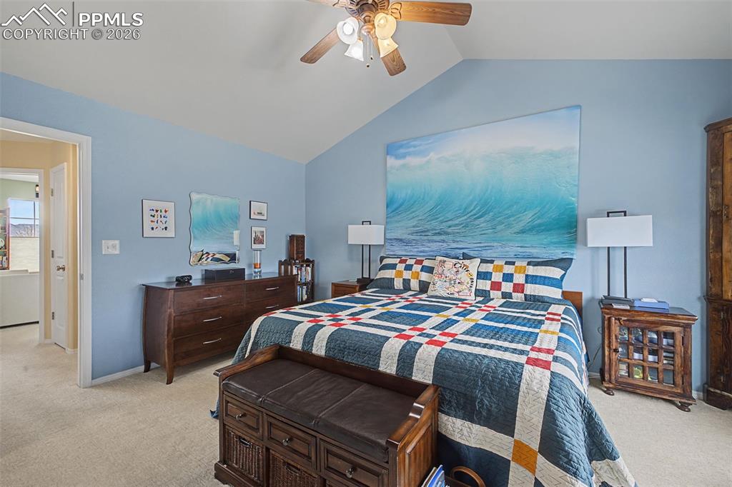 Image 21 of 50: Primary bedroom with vaulted ceilings and attached bath and walk in closet!