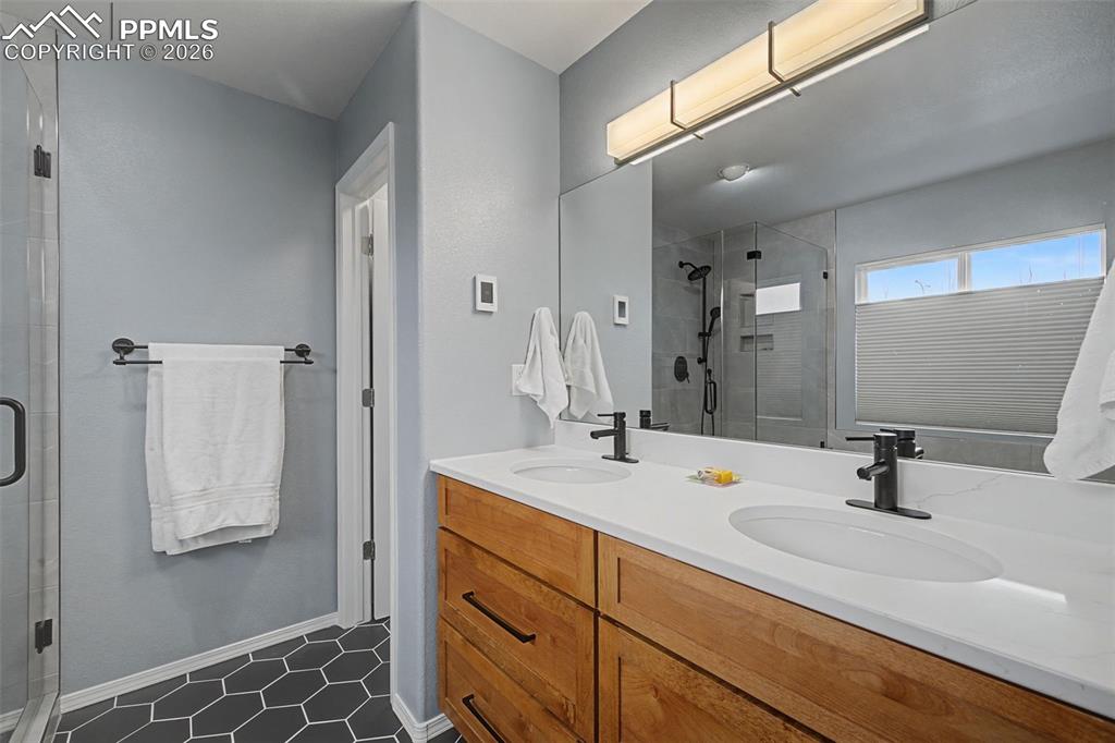 Image 22 of 50: Tastefully remodeled primary bedroom 5 piece bathroom.