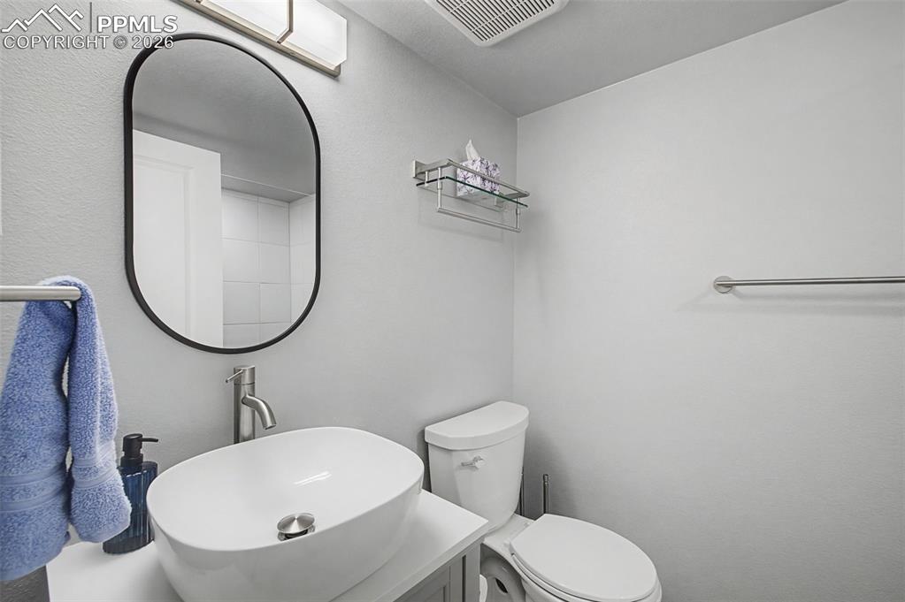 Image 32 of 50: Remodeled basement bathroom.