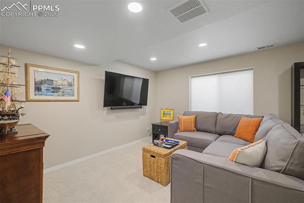 Image 34 of 50: Basement living room.