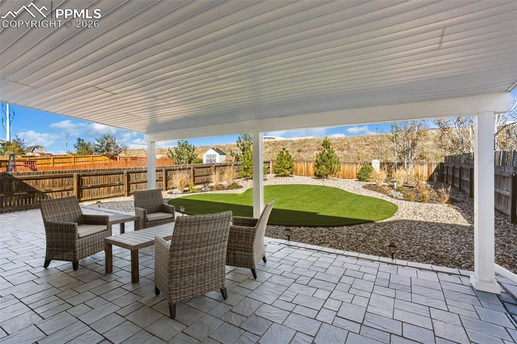 Image 4 of 50: Large stamped covered patio for entertaining!