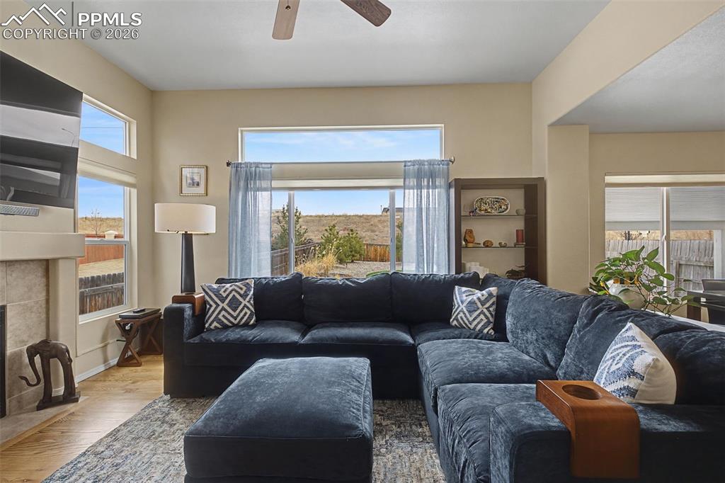 Image 8 of 50: Welcoming main level family room with more built ins and fireplace!