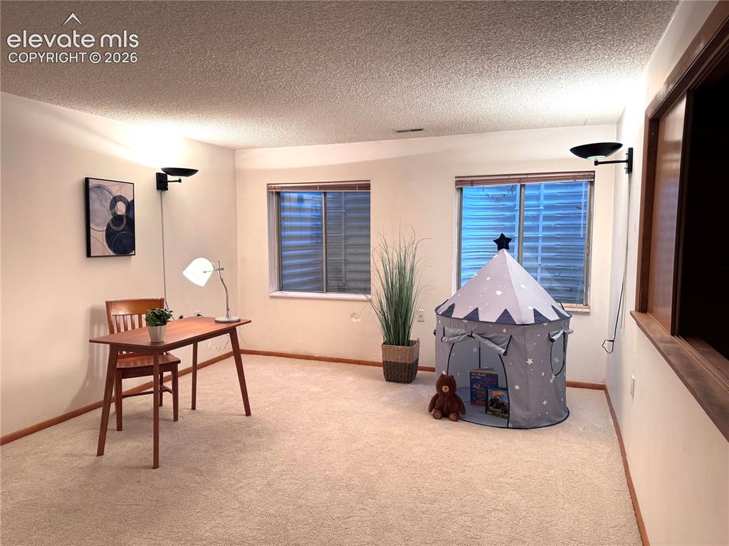 Image 10 of 48: A versatile basement family room for movie nights, game time, play room, or