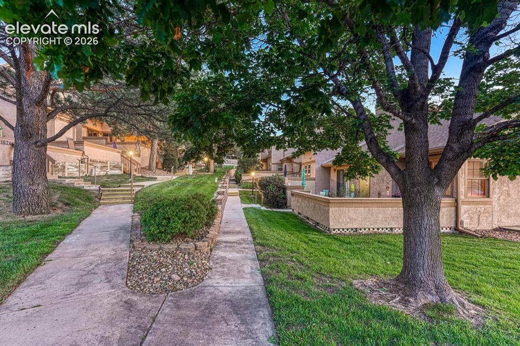 Image 14 of 48: Peaceful, well maintained community with tree-line streets and beautiful gr