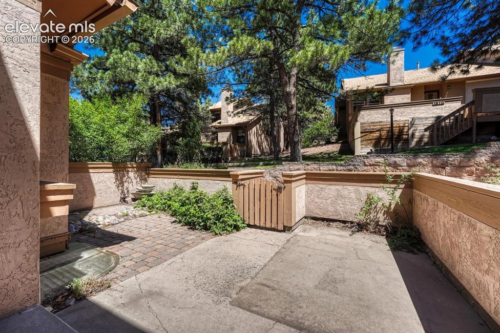 Image 16 of 48: View of courtyard from the front porch.