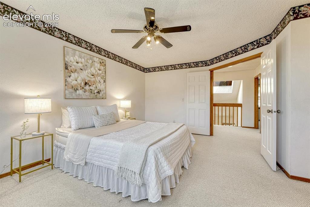 Image 32 of 48: Upper level primary bedroom.