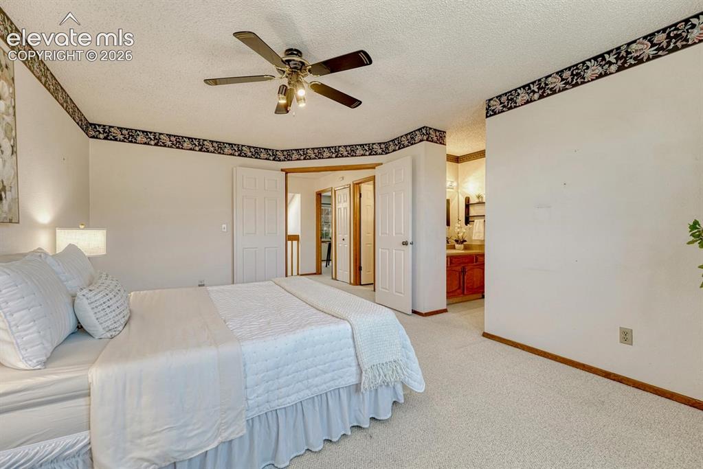 Image 33 of 48: The primary bedroom has an adjoining shower bathroom.