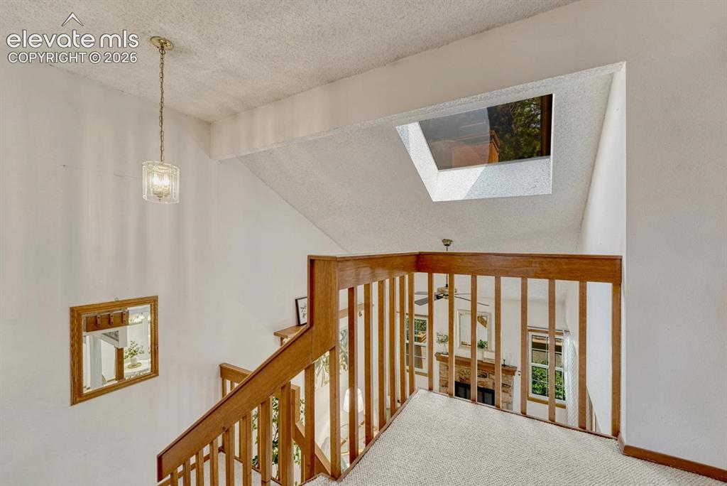 Image 7 of 48: Skylight at the top of the stairs that floods the home with lots of natural