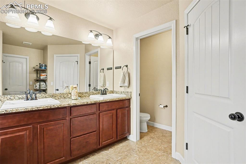 Image 14 of 31: Beautiful master bathroom with granite counters!