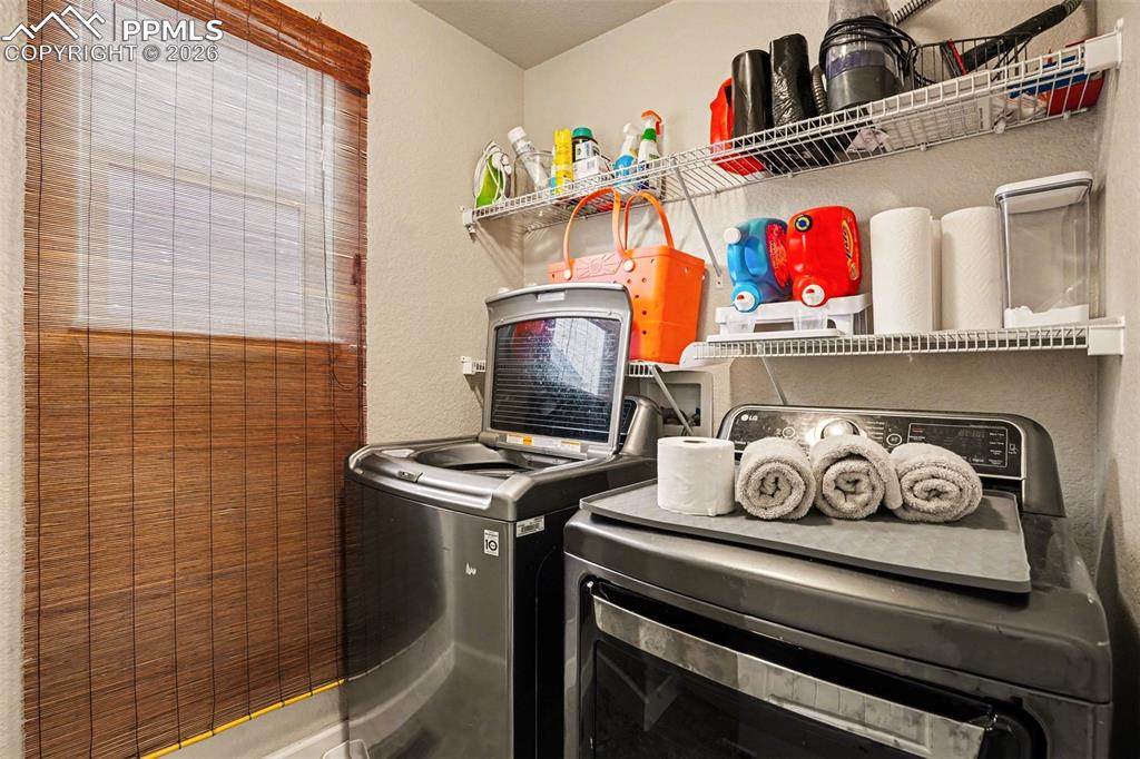 Image 20 of 31: Upstairs laundry room!