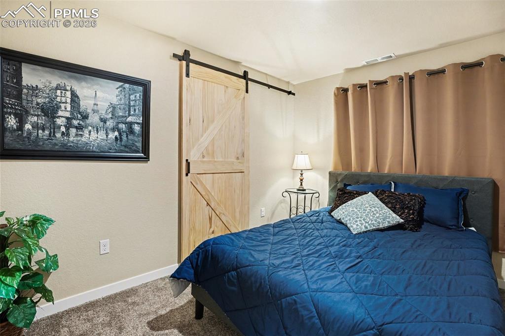Image 24 of 31: 5th bedroom in basement also with a walk-in closet