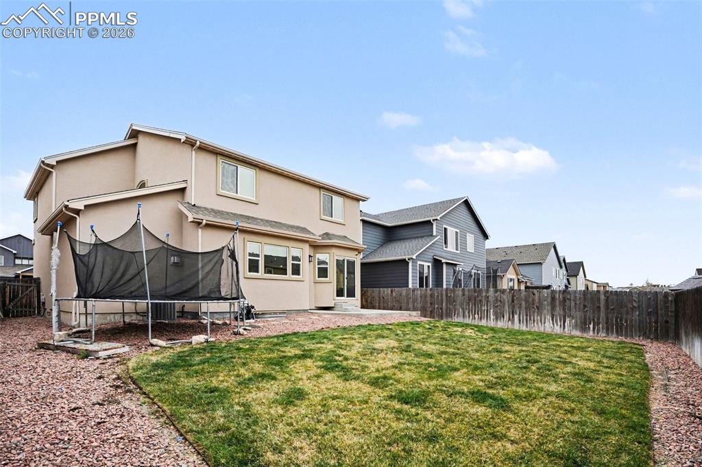 Image 26 of 31: Huge fenced back yard!