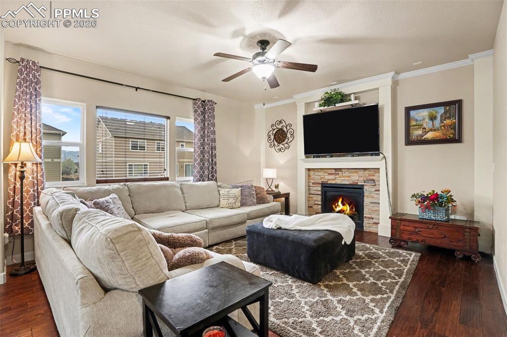 Image 3 of 31: Living room features gas fireplace!