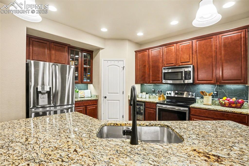 Image 8 of 31: Large pantry and stainless steel appliances!