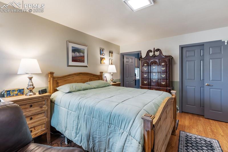Image 25 of 29: Bedroom featuring wood finished floors