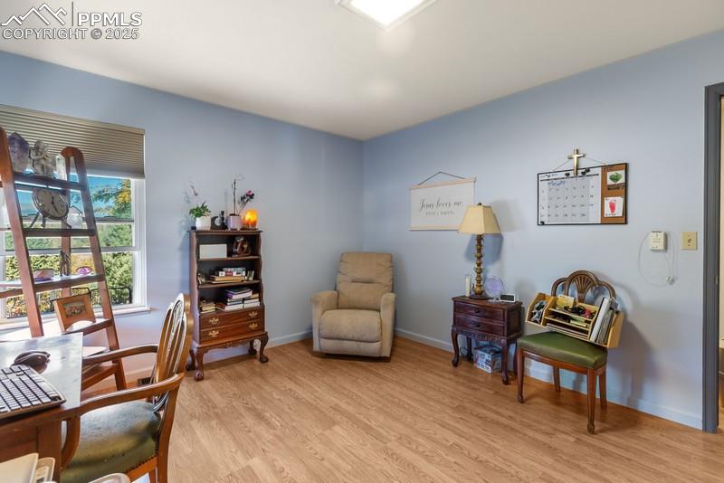 Image 29 of 29: Home office with light wood-style floors and baseboards