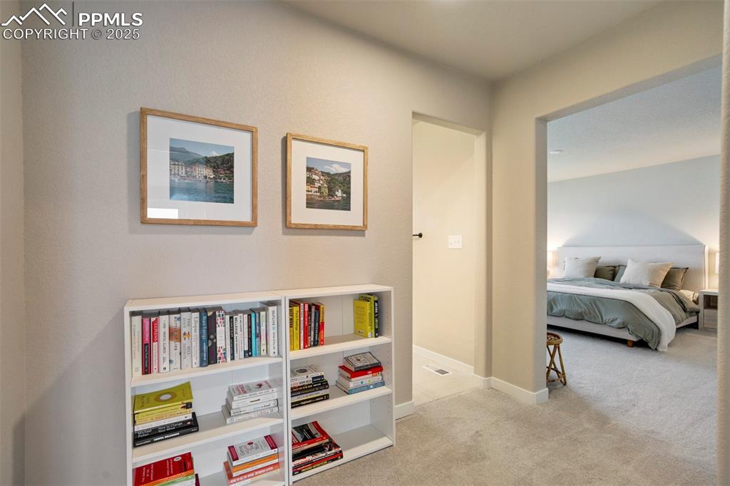 Image 15 of 47: Carpeted bedroom featuring baseboards