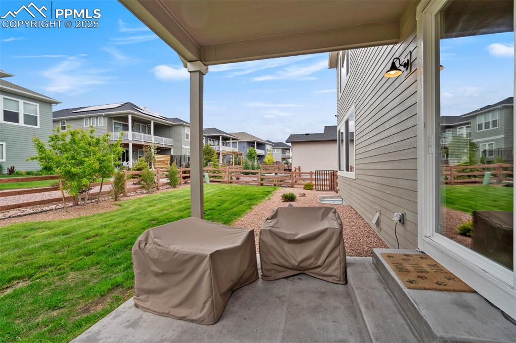 Image 42 of 47: View of patio with a residential view and a grill