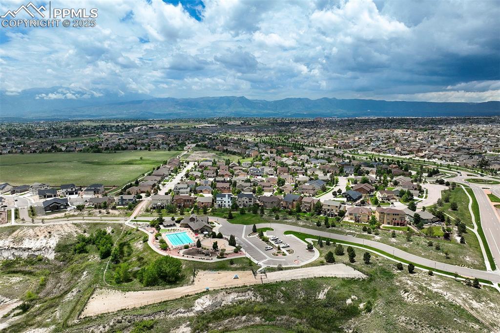 Image 47 of 47: Aerial view of surrounding area with nearby suburban area and mountains