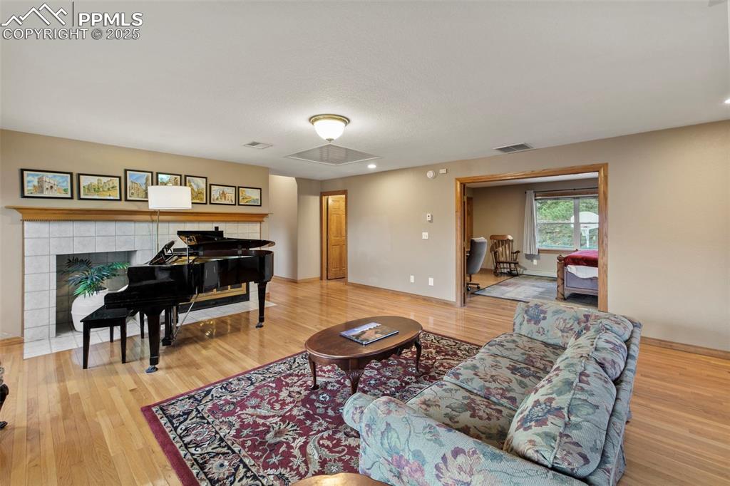 Image 6 of 50: Living room with light wood-style floors