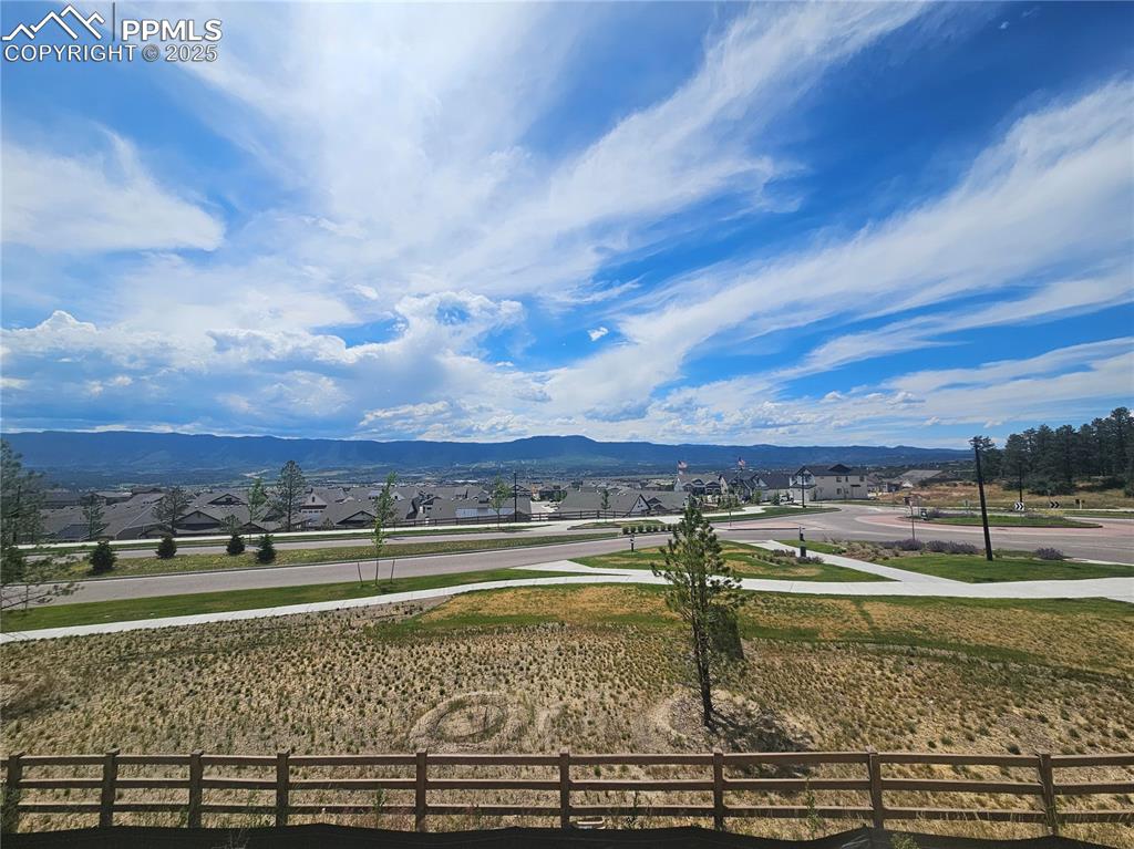 Image 12 of 16: View of mountain background featuring nearby suburban area