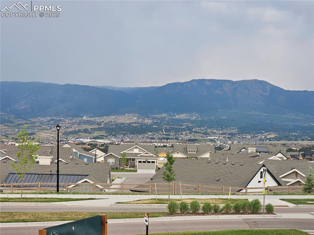 Image 16 of 16: View of mountain background featuring nearby suburban area