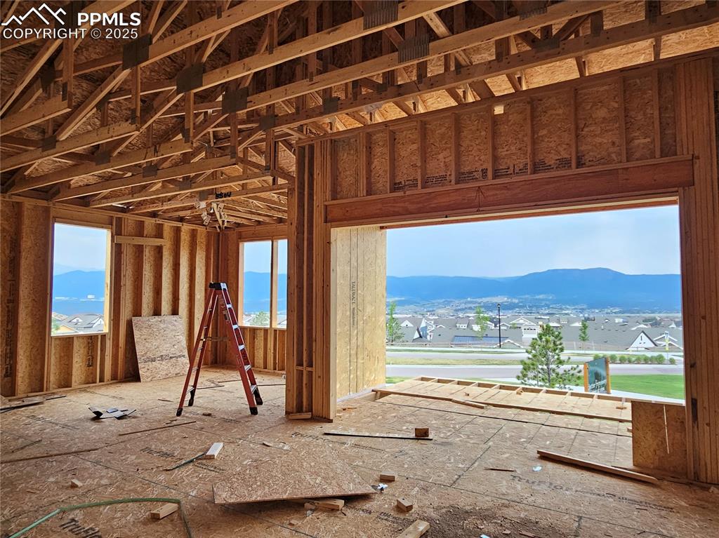 Image 5 of 16: Miscellaneous room featuring a mountain view