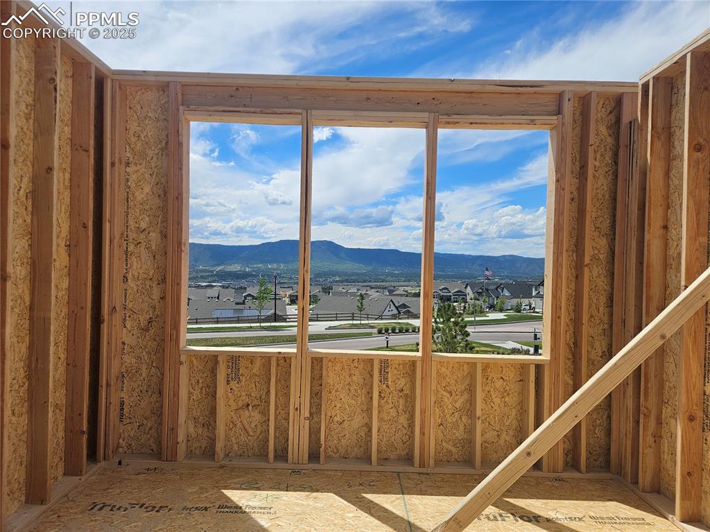 Image 9 of 16: Misc room featuring a residential view and a mountain view