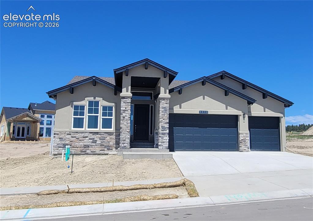 Caption: Hillingdon-Craftsman Elevation-3 Car Garage-Finished Basement with 9
