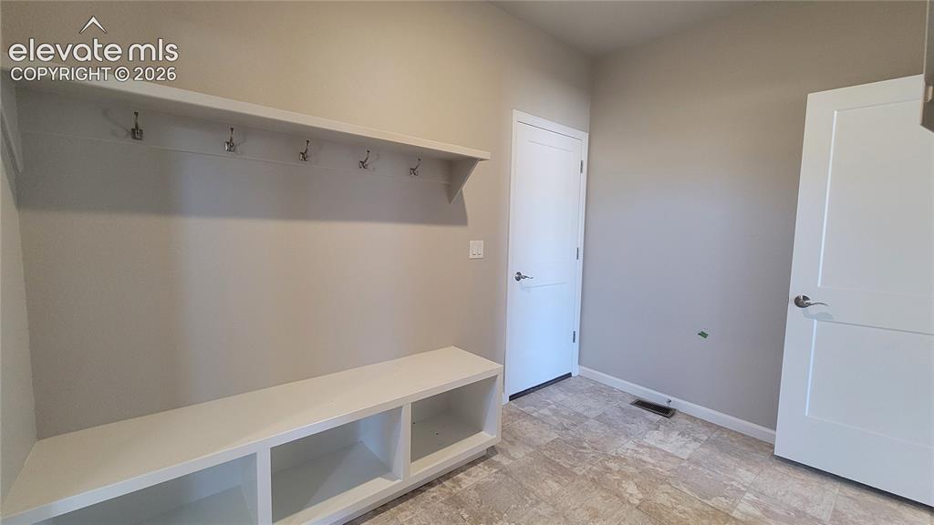 Image 19 of 29: Laundry room conveniently attached to the primary walk-in closet! Please, e