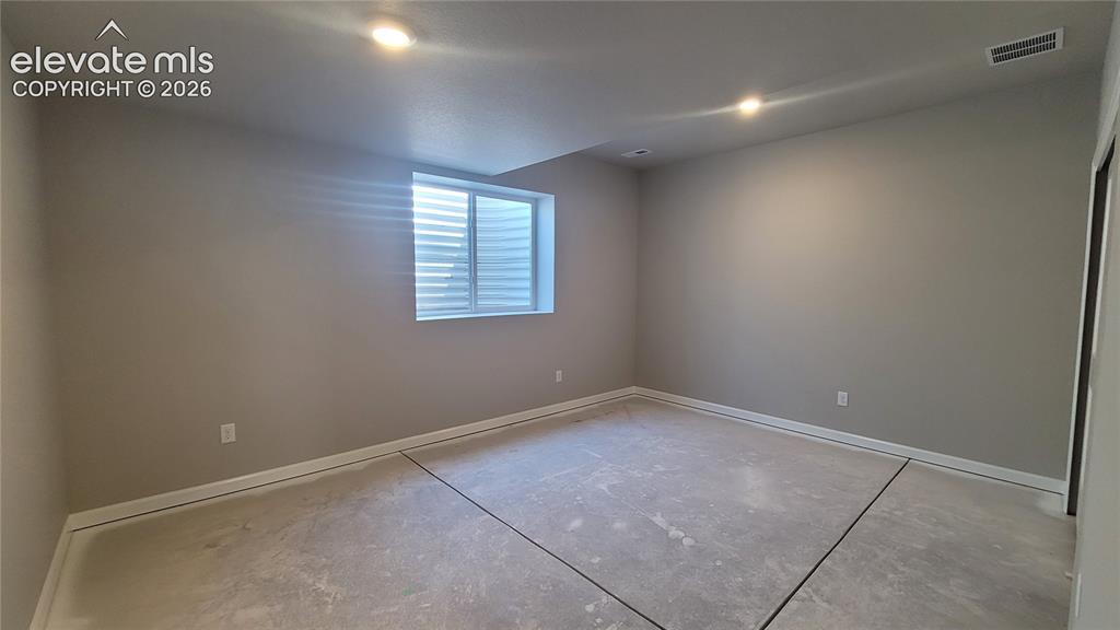 Image 23 of 29: 3rd Bedroom with built-in shelving, located in the lower-level! Please, exc